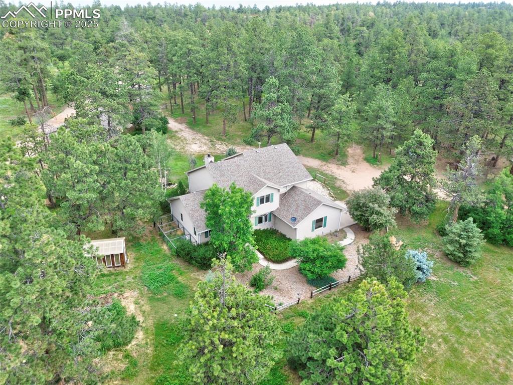 6290 Old Ranch Road Colorado Springs, CO 80908 - Photo 2 of 48 an aerial view of residential house with outdoor space and trees all around