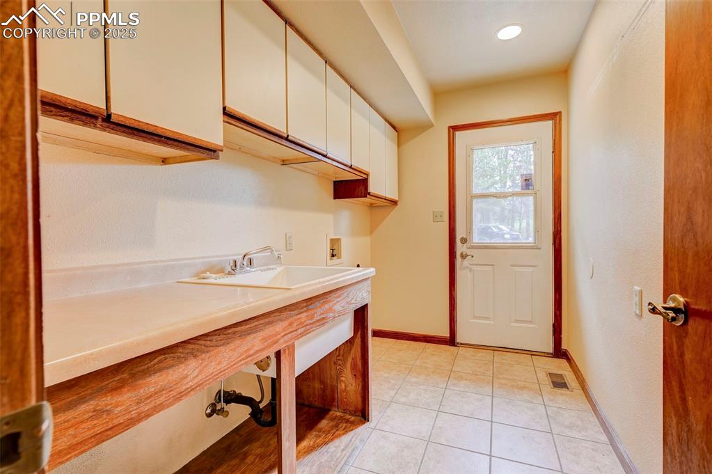 6290 Old Ranch Road Colorado Springs, CO 80908 - Photo 24 of 48 a bathroom with a sink and a mirror