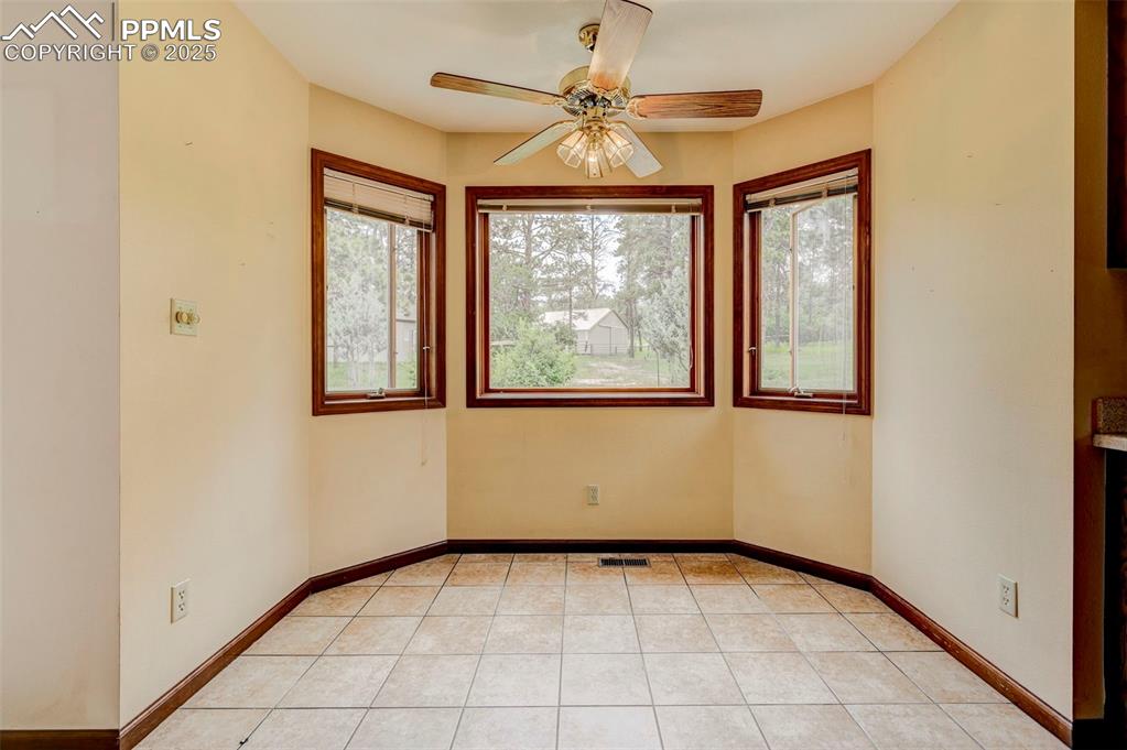 6290 Old Ranch Road Colorado Springs, CO 80908 - Photo 26 of 48 an empty room with windows and fan
