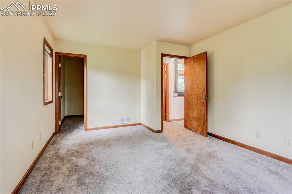 6290 Old Ranch Road Colorado Springs, CO 80908 - Photo 38 of 48 a view of an empty room with closet and a window