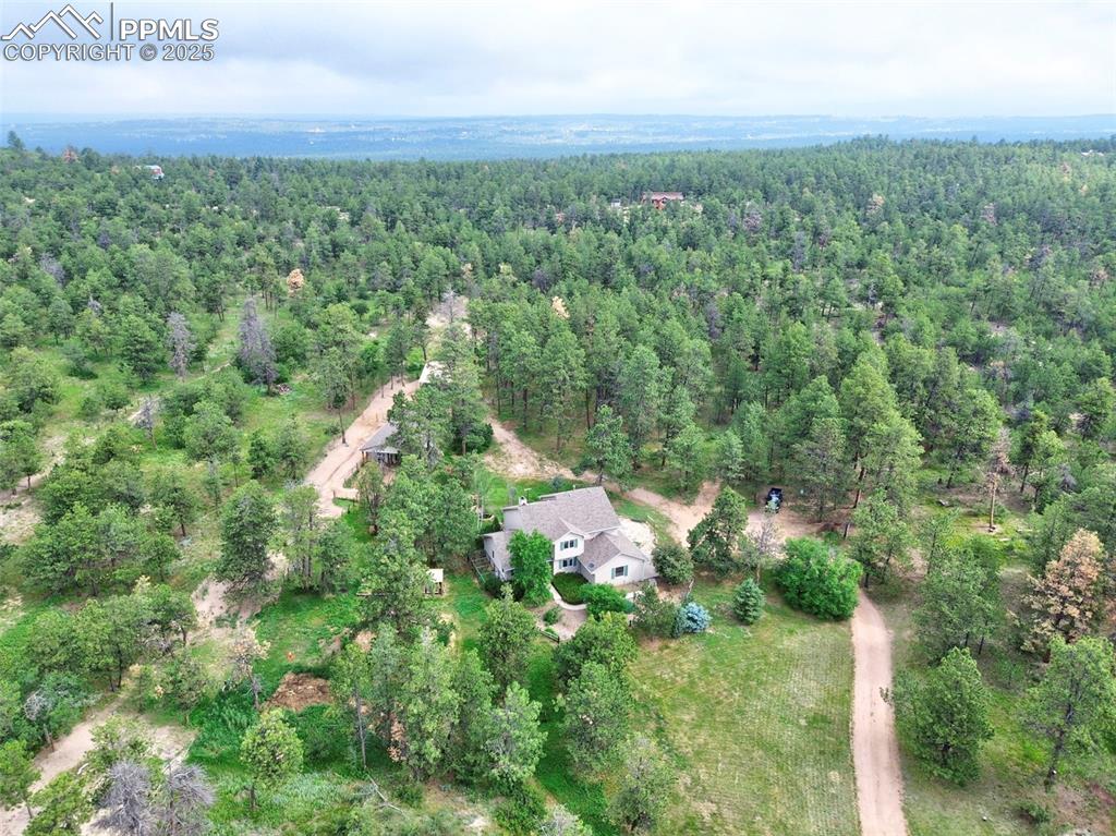 6290 Old Ranch Road Colorado Springs, CO 80908 - Photo 4 of 48 an aerial view of residential houses with outdoor space and trees