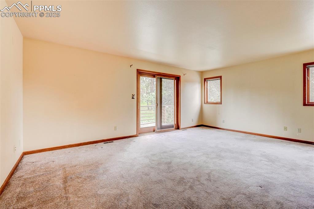 6290 Old Ranch Road Colorado Springs, CO 80908 - Photo 43 of 48 an empty room with windows and closet