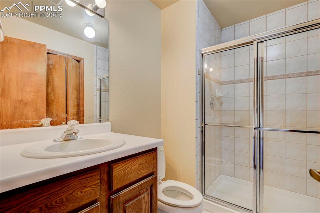 6290 Old Ranch Road Colorado Springs, CO 80908 - Photo 44 of 48 a bathroom with a sink toilet and shower