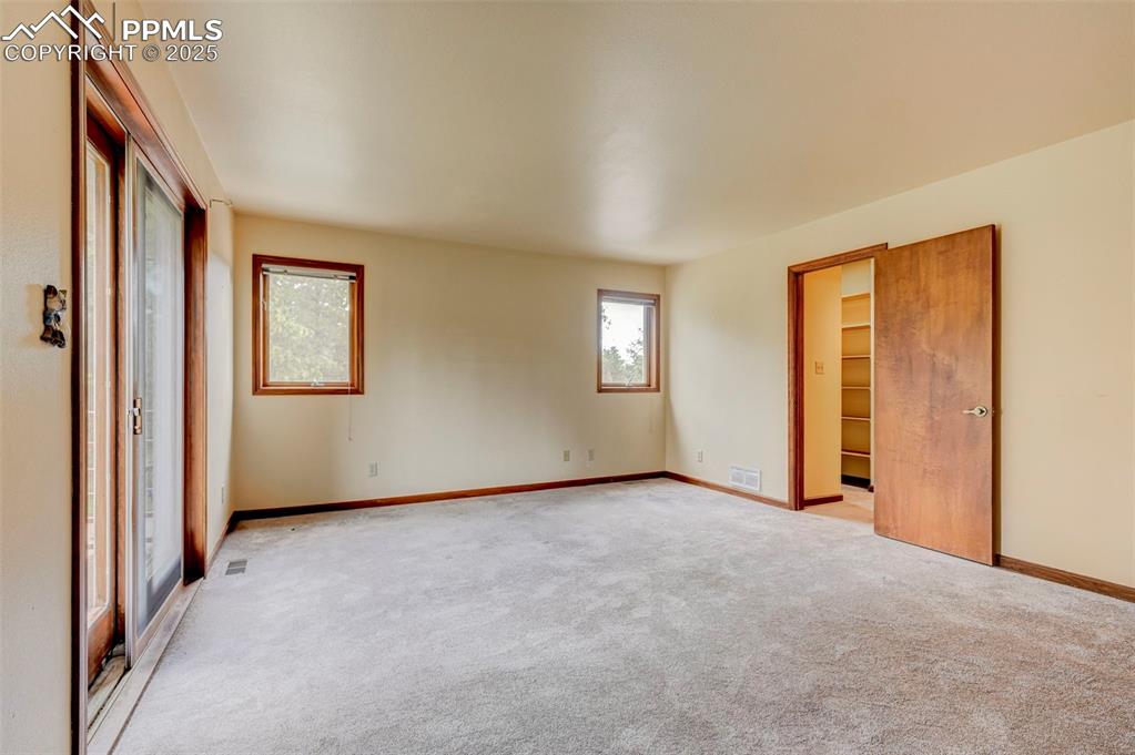 6290 Old Ranch Road Colorado Springs, CO 80908 - Photo 46 of 48 an empty room with windows and closet