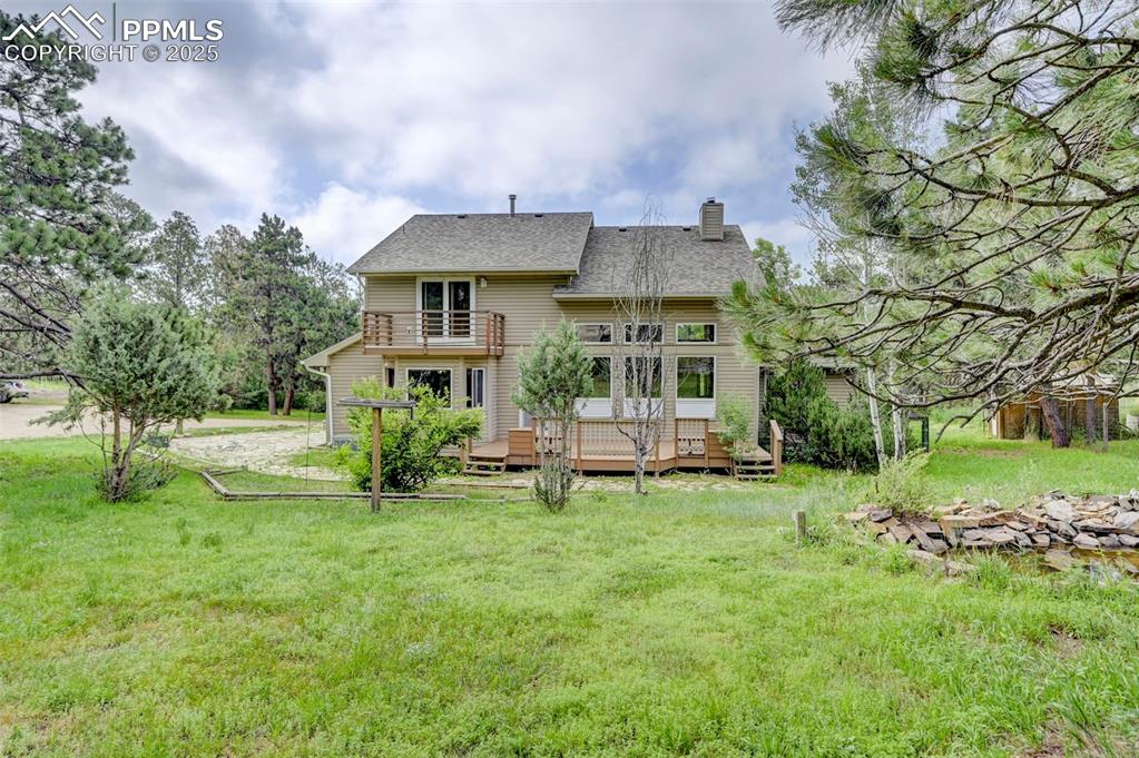 6290 Old Ranch Road Colorado Springs, CO 80908 - Photo 5 of 48 a view of a house with a yard and sitting area