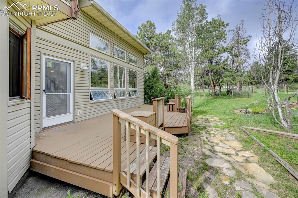 6290 Old Ranch Road Colorado Springs, CO 80908 - Photo 7 of 48 a view of house with backyard and outdoor seating