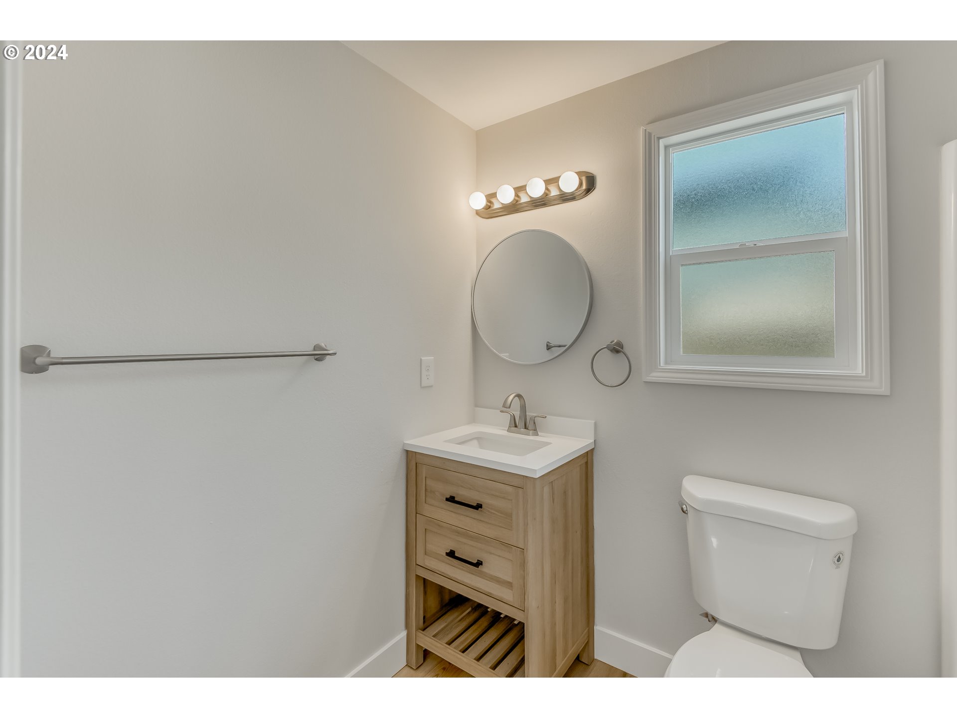 8640 Southwest 133rd Avenue Beaverton, OR 97008 - Photo 17 of 25 a bathroom with a toilet a sink and mirror