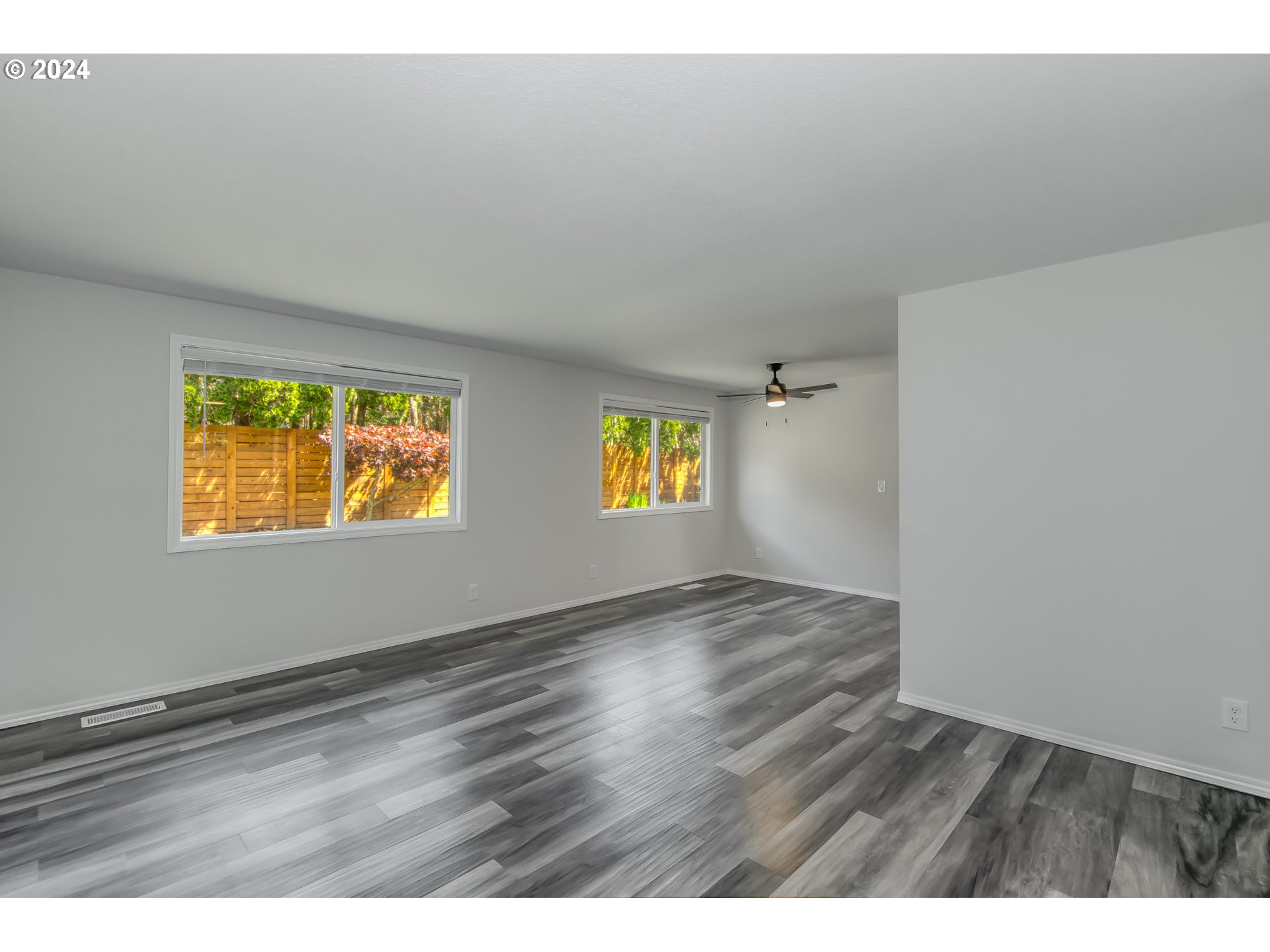 8640 Southwest 133rd Avenue Beaverton, OR 97008 - Photo 3 of 25 a view of an empty room and window