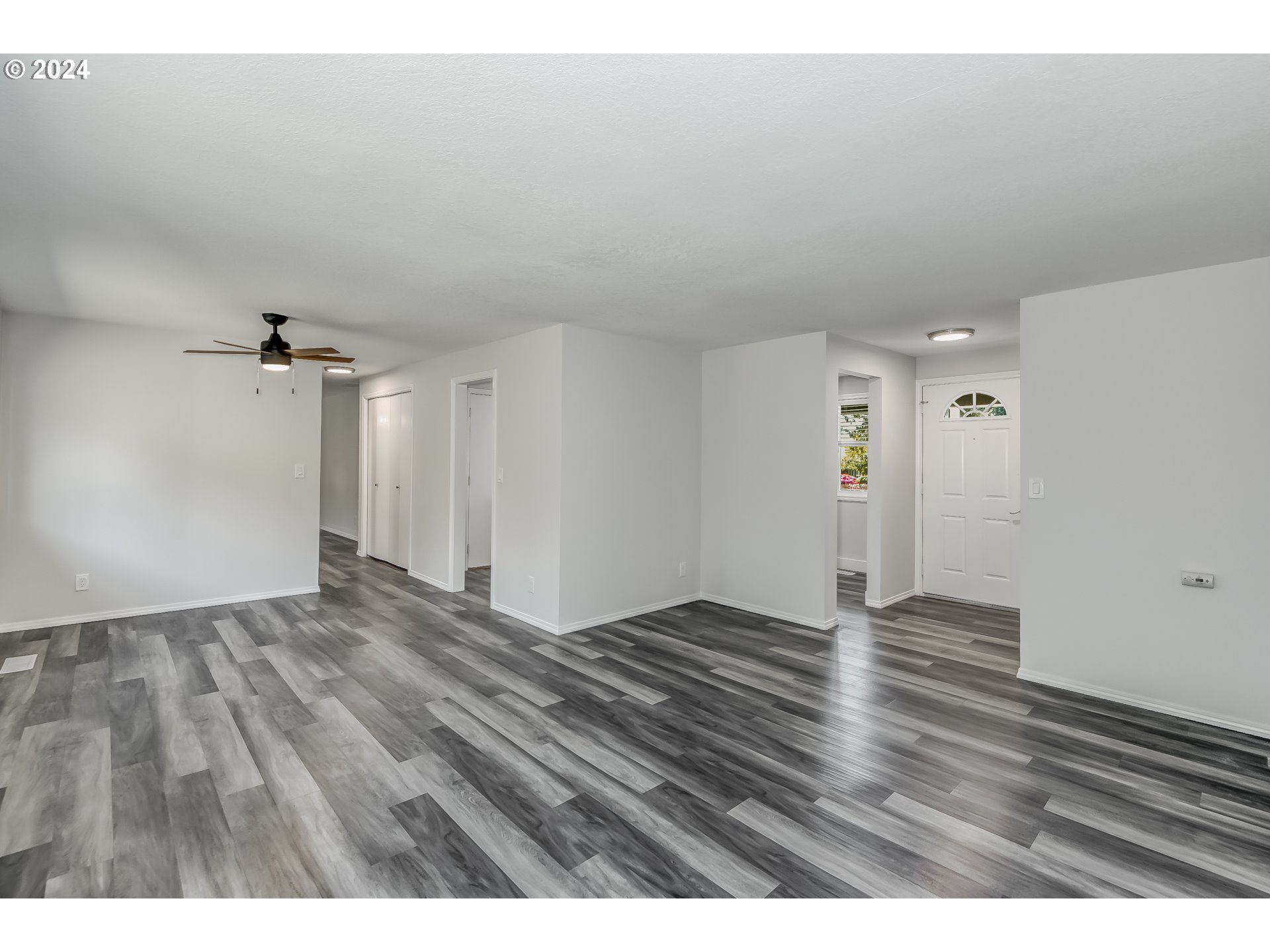 8640 Southwest 133rd Avenue Beaverton, OR 97008 - Photo 4 of 25 a view of an empty room and wooden floor