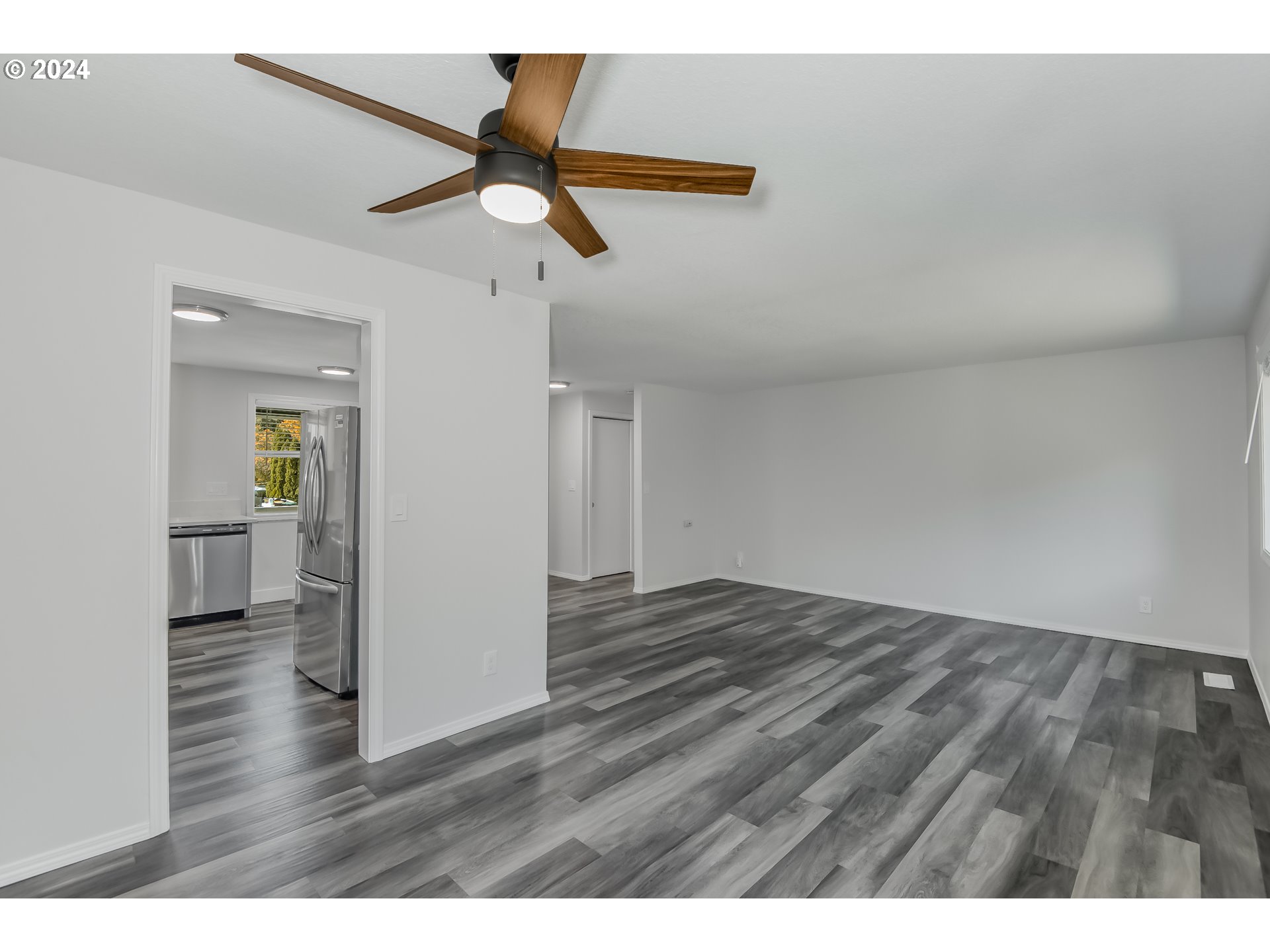 8640 Southwest 133rd Avenue Beaverton, OR 97008 - Photo 6 of 25 a view of empty room with wooden floor