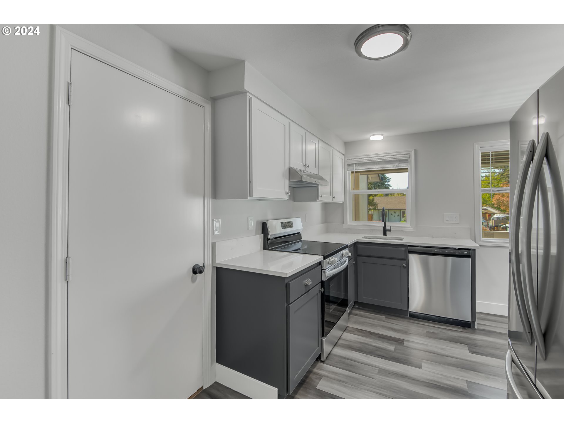 8640 Southwest 133rd Avenue Beaverton, OR 97008 - Photo 7 of 25 a kitchen with a sink cabinets stainless steel appliances and a window