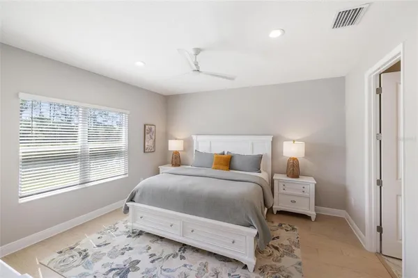 a bedroom with a bed and a dresser