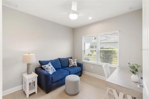 a bedroom with a bed and a lamp