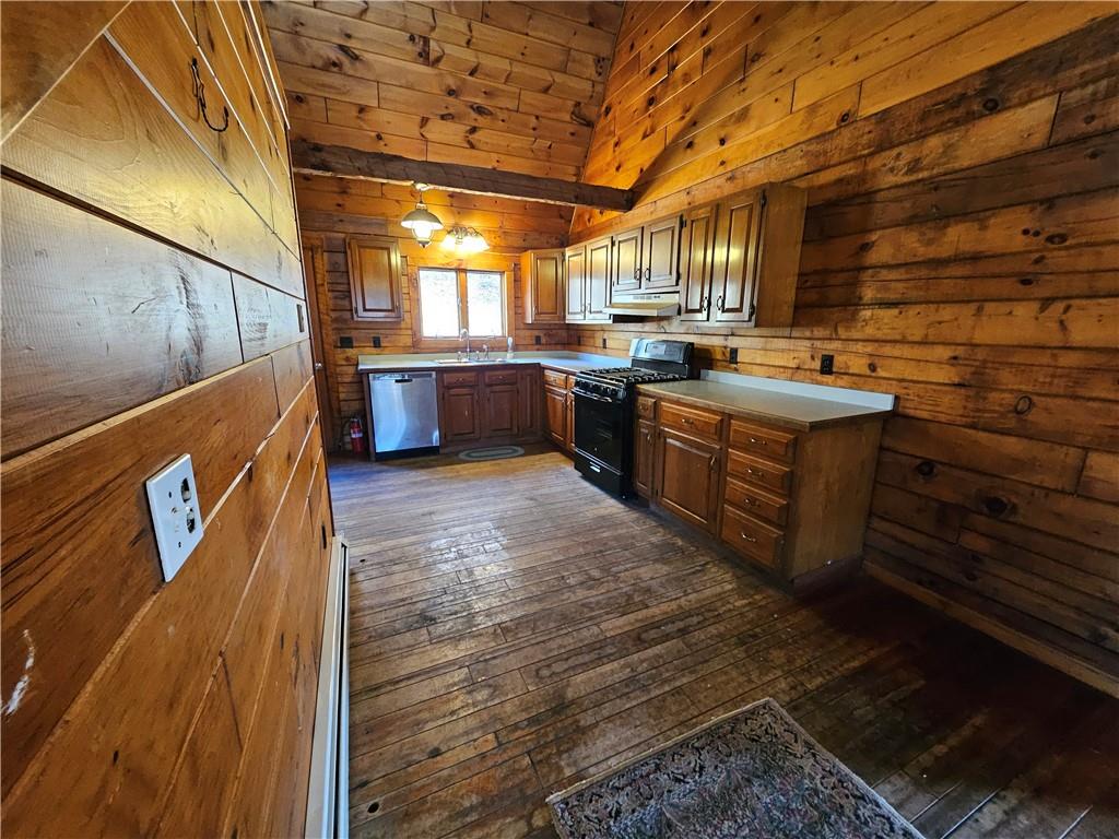 734 Torpedo Road Pittsfield, PA 16340 - Photo 12 of 33 a room with stainless steel appliances wooden cabinets and a stove