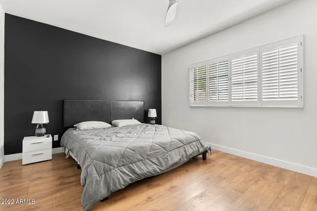 a bedroom with a bed and window