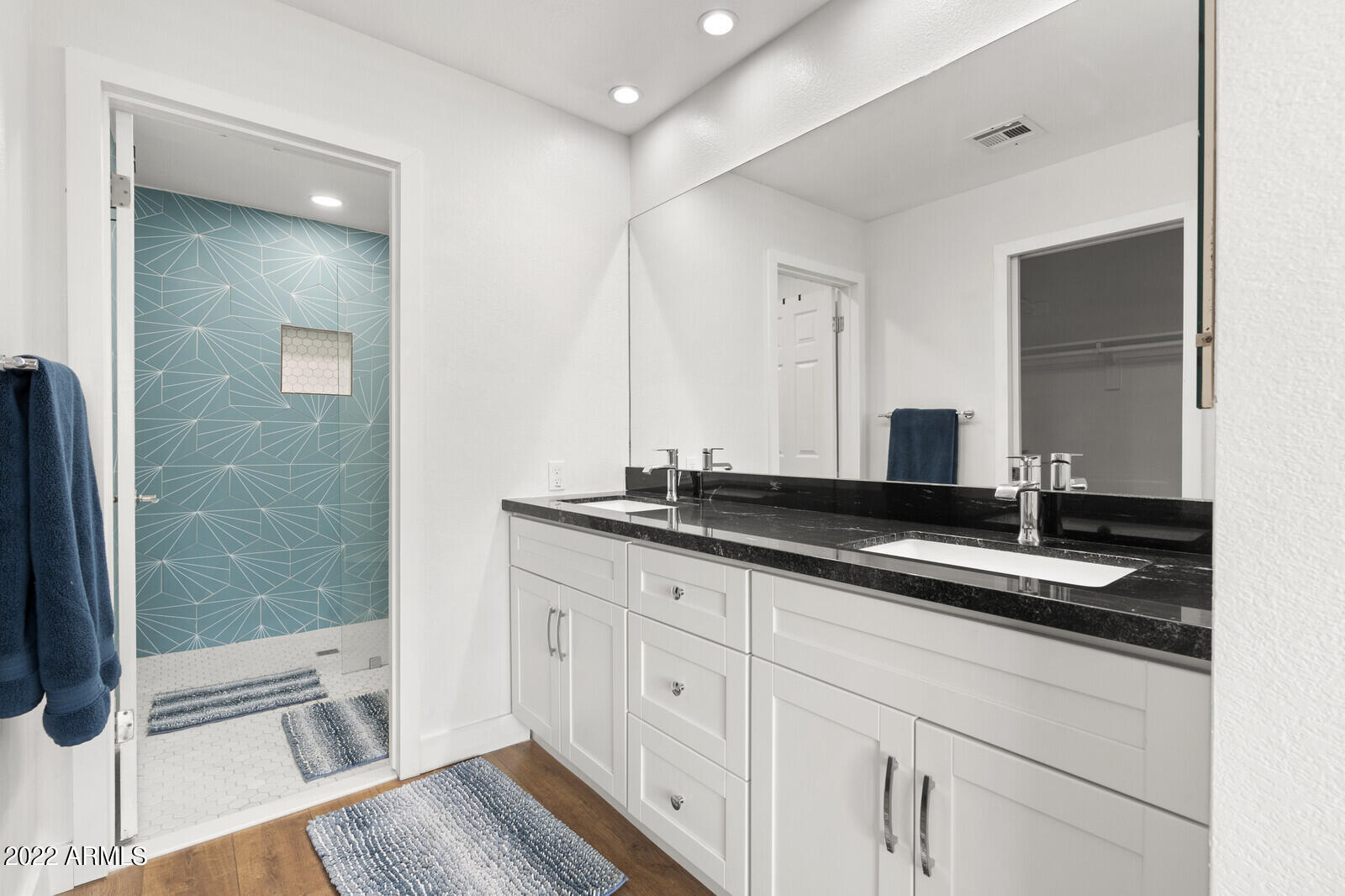 3047 East Rose Lane Phoenix, AZ 85016 - Photo 13 of 27 a bathroom with a granite countertop sink a mirror and a shower
