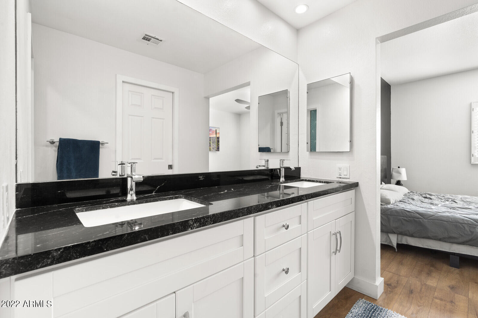 3047 East Rose Lane Phoenix, AZ 85016 - Photo 14 of 27 a bathroom with a granite countertop sink and a mirror