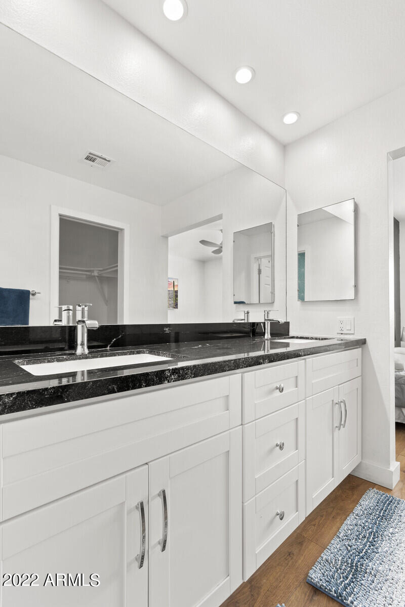 3047 East Rose Lane Phoenix, AZ 85016 - Photo 15 of 27 a bathroom with a sink and a mirror