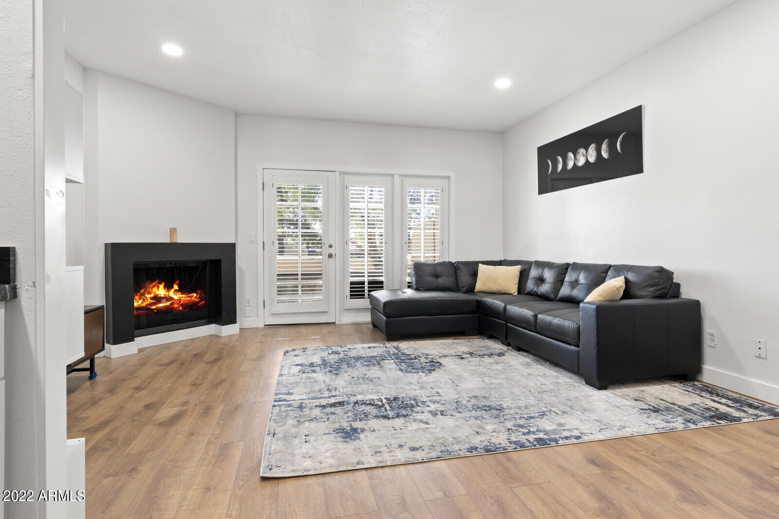 3047 East Rose Lane Phoenix, AZ 85016 - Photo 2 of 27 a living room with furniture and a fireplace