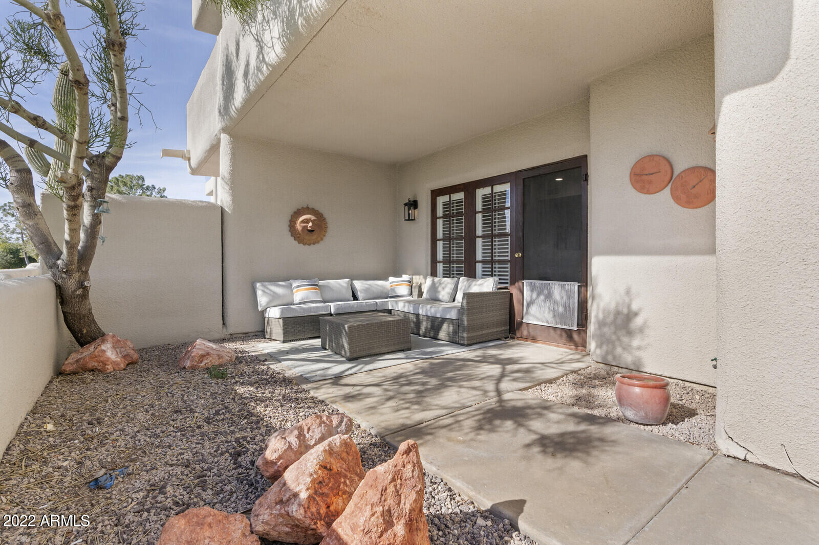 3047 East Rose Lane Phoenix, AZ 85016 - Photo 22 of 27 a bed room with a bed and a couch