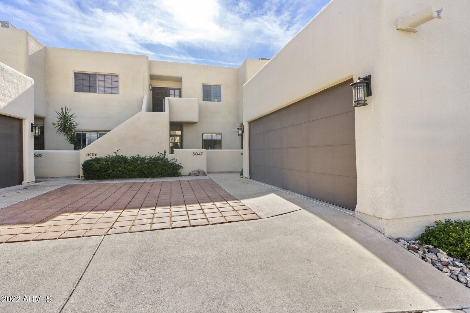 3047 East Rose Lane Phoenix, AZ 85016 - Photo 27 of 27 a front view of a house with a yard and garage