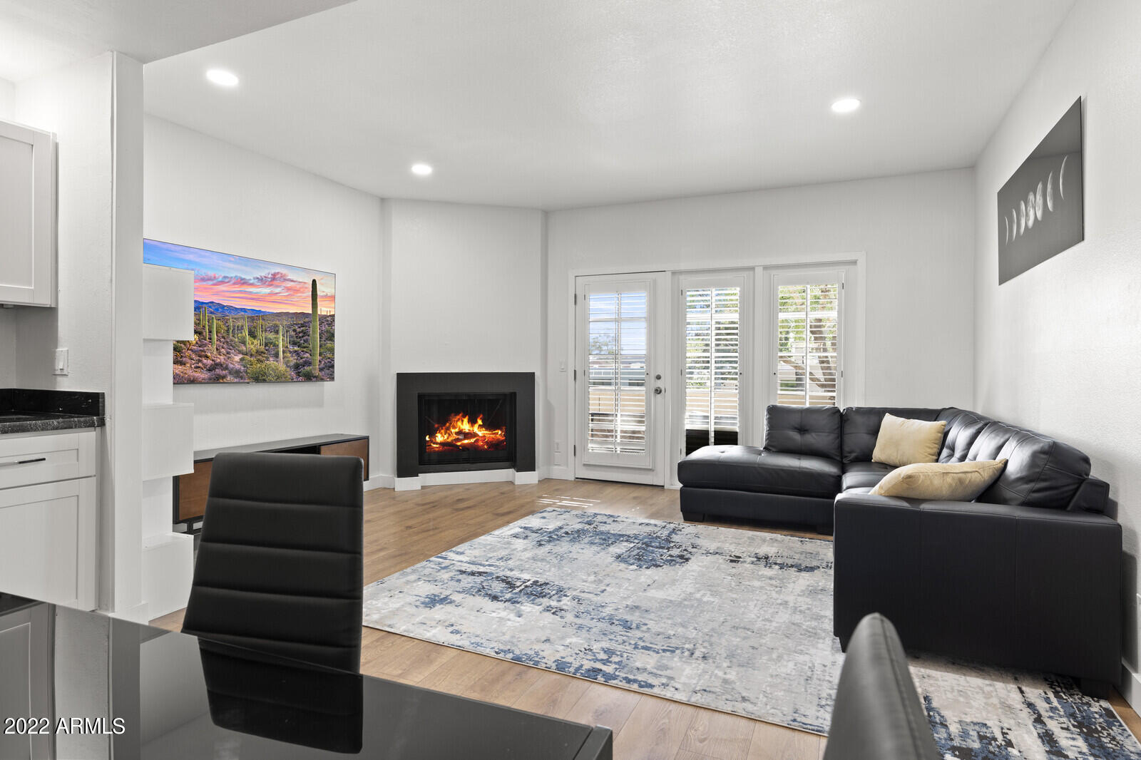 3047 East Rose Lane Phoenix, AZ 85016 - Photo 3 of 27 a living room with furniture and a fireplace
