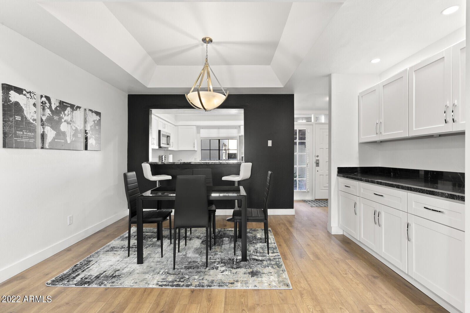 3047 East Rose Lane Phoenix, AZ 85016 - Photo 7 of 27 a view of dining table chairs and wooden floor