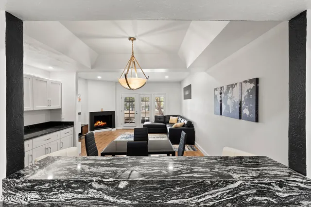 a living room with fireplace furniture and a flat screen tv