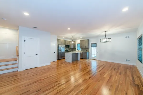 a view of kitchen with wooden floor
