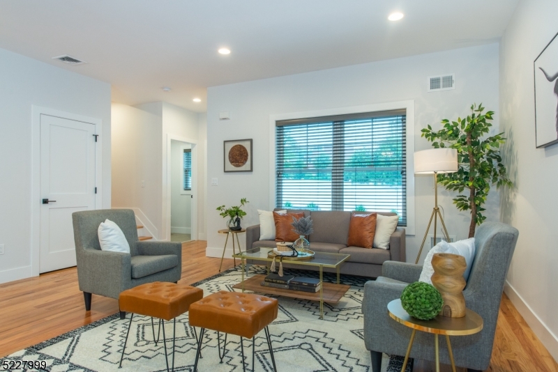 360 Orange Road, Unit 4 Montclair, NJ 07042 - Photo 5 of 37 a living room with furniture and a large window