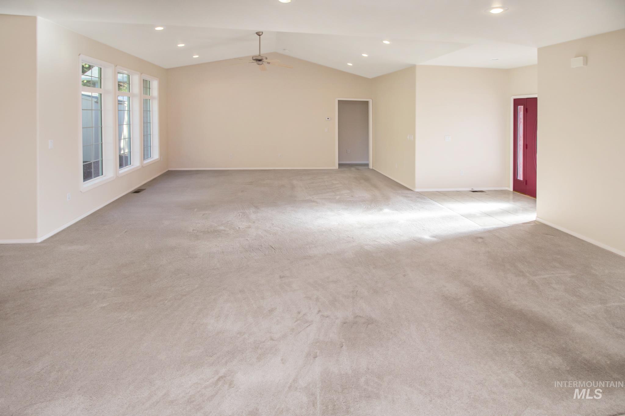 2133 13th Street Lewiston, ID 83501 - Photo 13 of 38 Expansive room featuring vaulted ceilings with recessed lighting and a ceiling fan