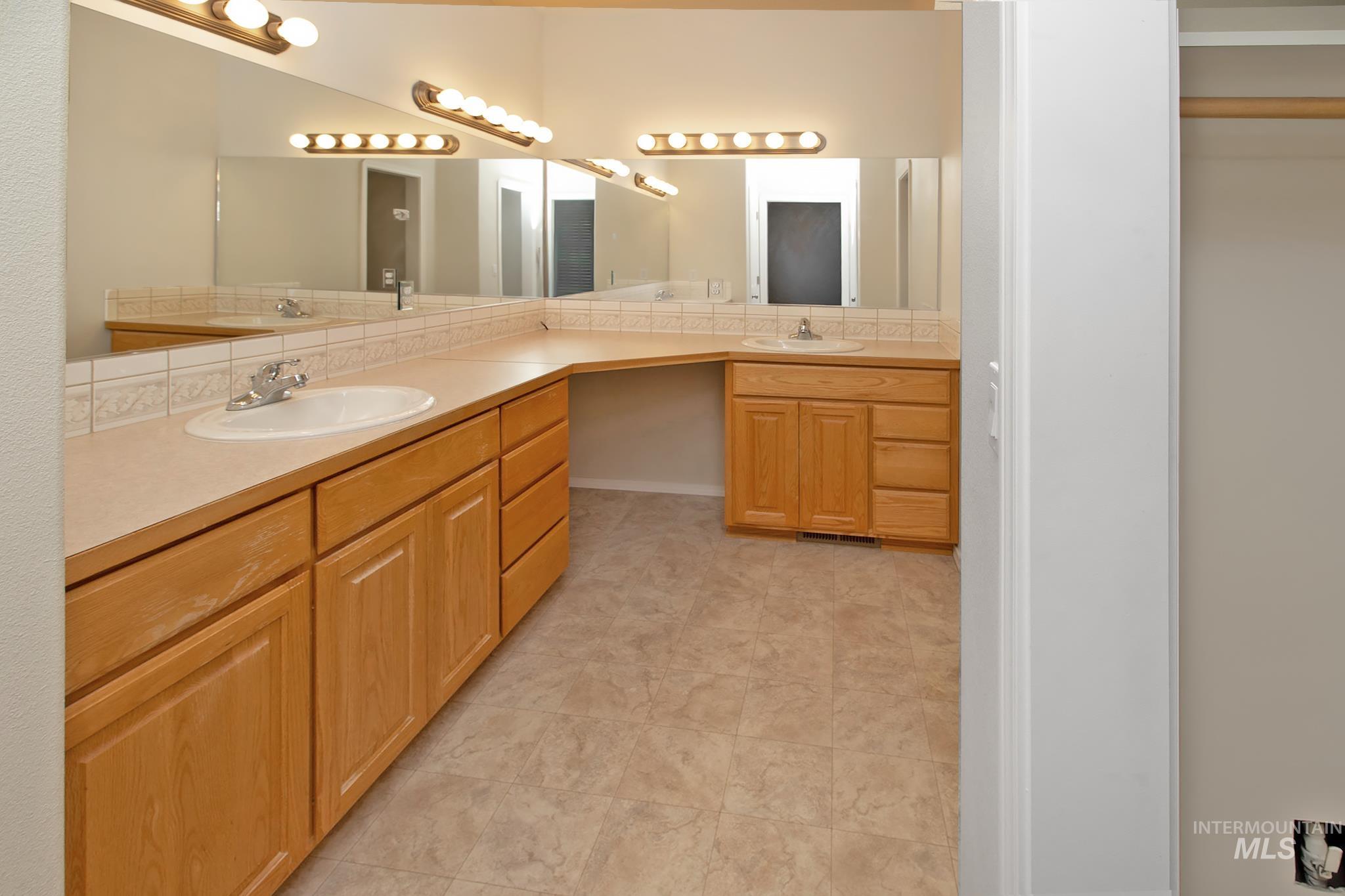 2133 13th Street Lewiston, ID 83501 - Photo 18 of 38 Dual vanity with integrated sinks and chrome faucets