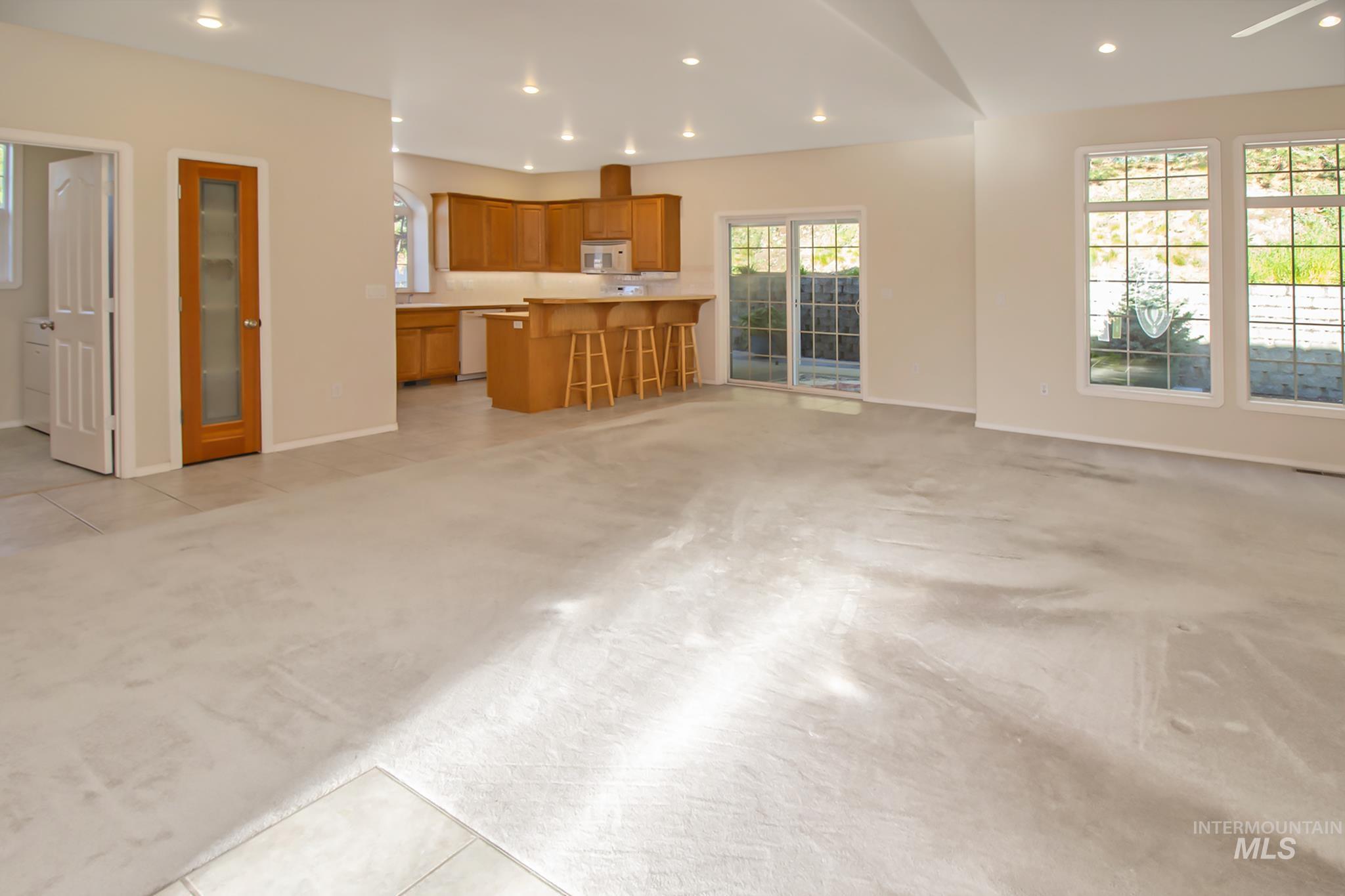 2133 13th Street Lewiston, ID 83501 - Photo 6 of 38 Open-concept living area with recessed lighting, light-toned carpeting, and multiple windows