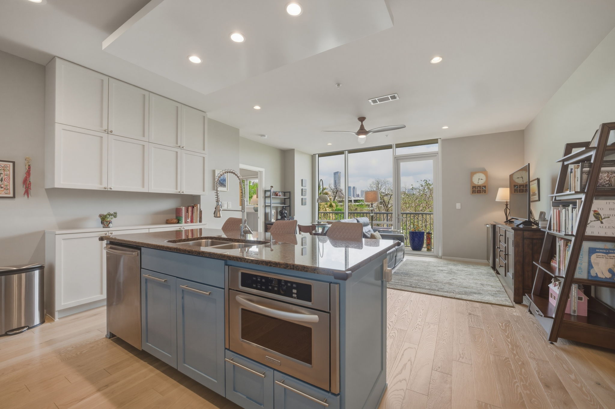 1600 Barton Springs Road, Unit 4305 Austin, TX 78704 - Photo 25 of 26 a kitchen with stainless steel appliances granite countertop a stove and a sink