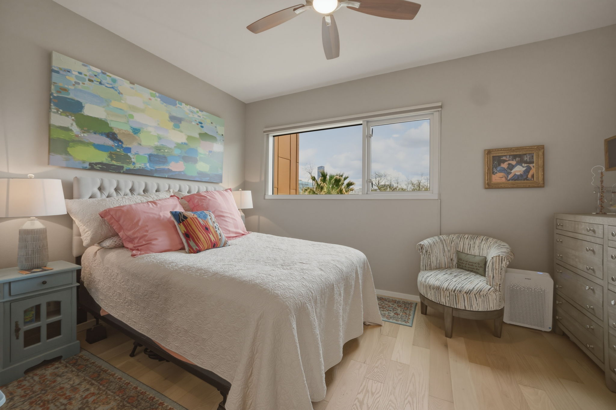 1600 Barton Springs Road, Unit 4305 Austin, TX 78704 - Photo 9 of 26 a bedroom with a bed and a painting on the wall