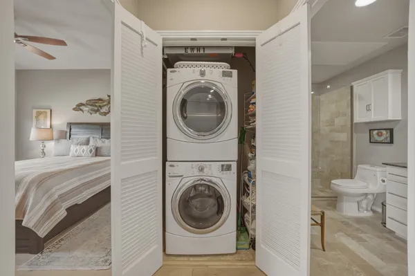 a bedroom with a bed a desk and chair