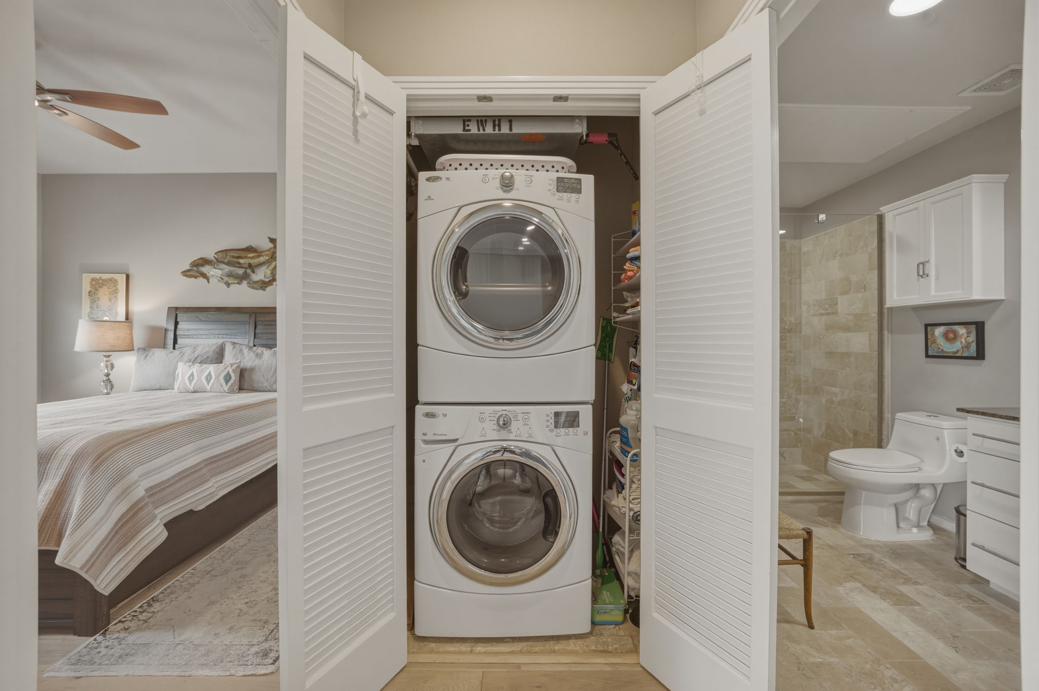 1600 Barton Springs Road, Unit 4305 Austin, TX 78704 - Photo 17 of 26 a view of a bedroom with washer and dryer