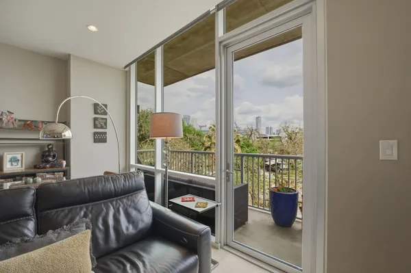 a bathroom with a granite countertop sink a toilet and a mirror