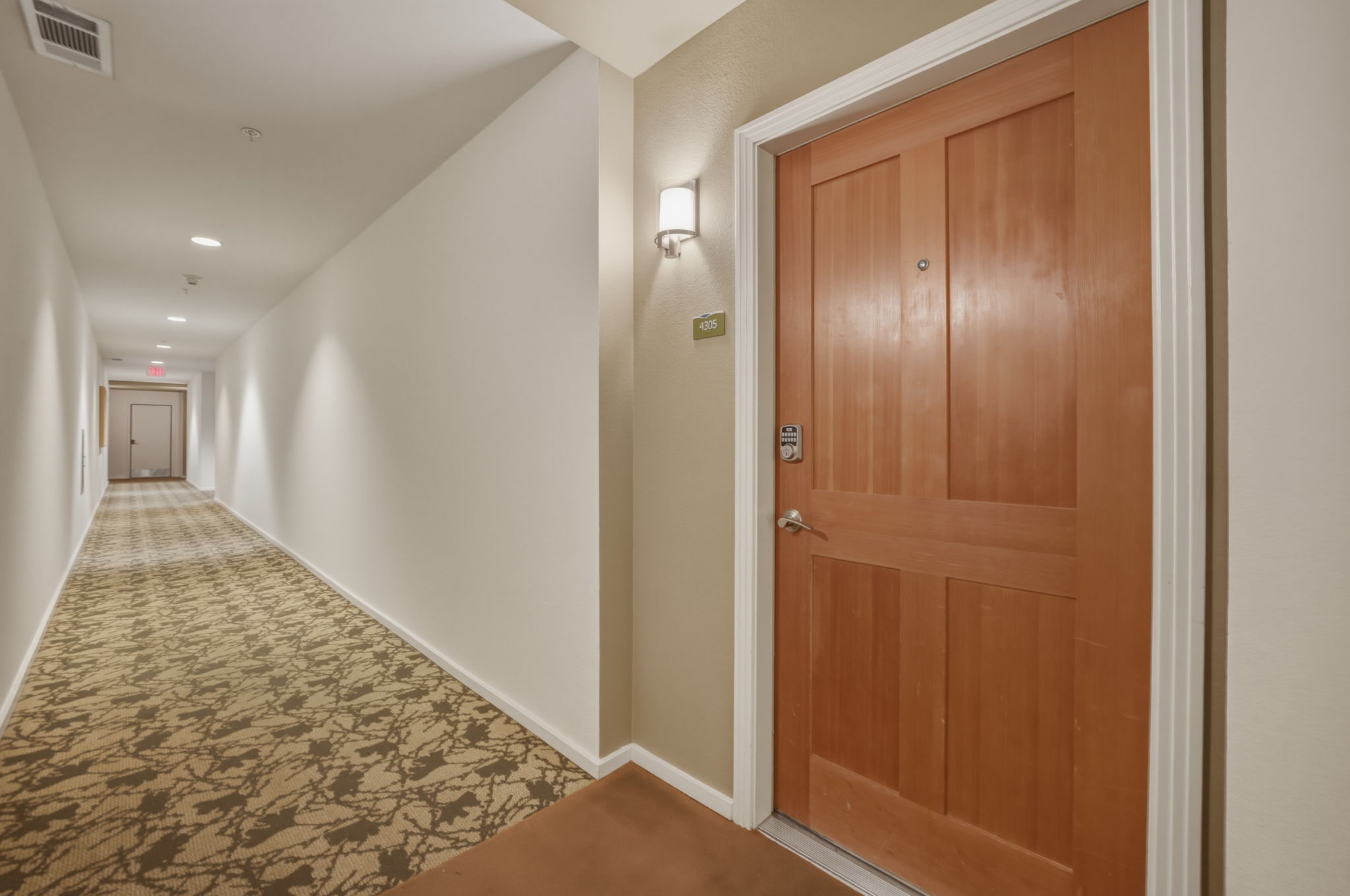 1600 Barton Springs Road, Unit 4305 Austin, TX 78704 - Photo 2 of 26 a view of hallway with wooden floor