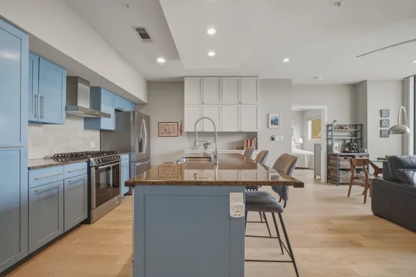 a view of hallway with wooden floor
