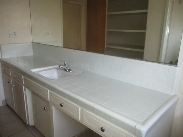 a bathroom with a sink and vanity