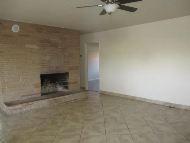an empty room with a fireplace