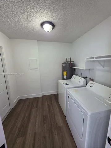 a view of a storage & utility room with a window