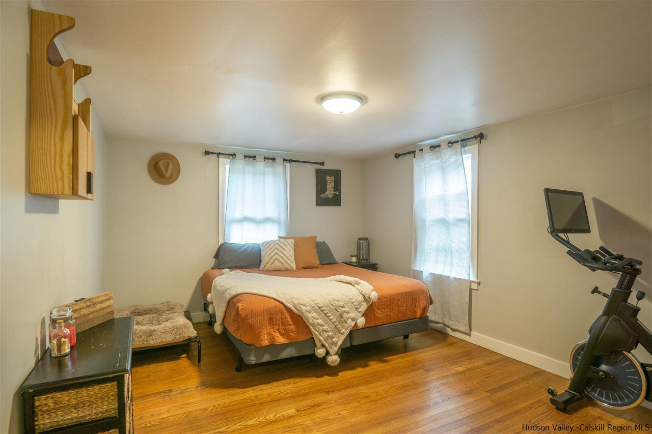 207 Marshall Road Salt Point, NY 12578 - Photo 14 of 22 a bedroom with a bed and wooden floor