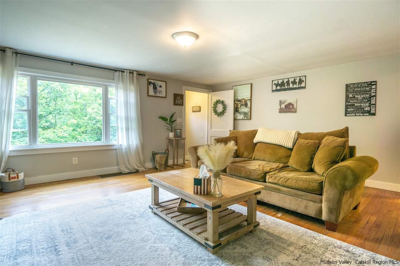 207 Marshall Road Salt Point, NY 12578 - Photo 6 of 22 a living room with furniture and a large window