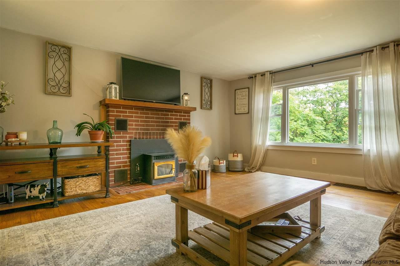 207 Marshall Road Salt Point, NY 12578 - Photo 8 of 22 a living room with furniture a flat screen tv and a fireplace