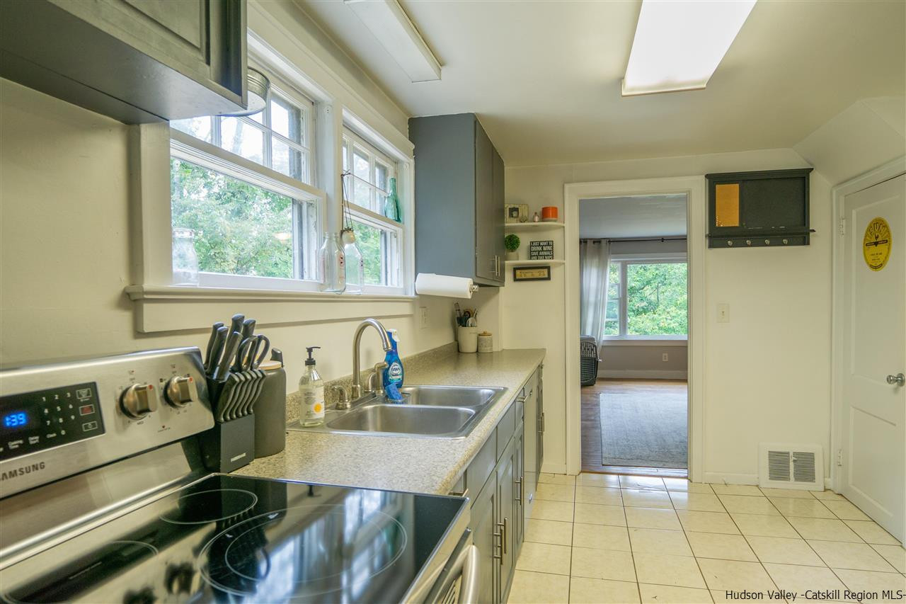 207 Marshall Road Salt Point, NY 12578 - Photo 10 of 22 a kitchen with granite countertop a sink and a stove top oven