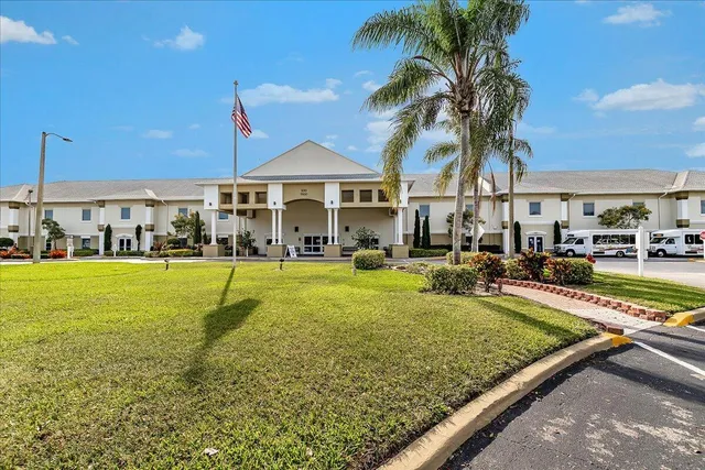 a view of a house with swimming pool and a yard
