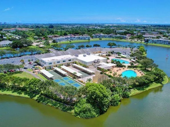 an aerial view of a house with a lake view