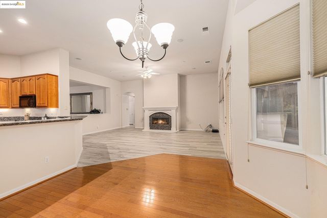 a large white kitchen with a large window